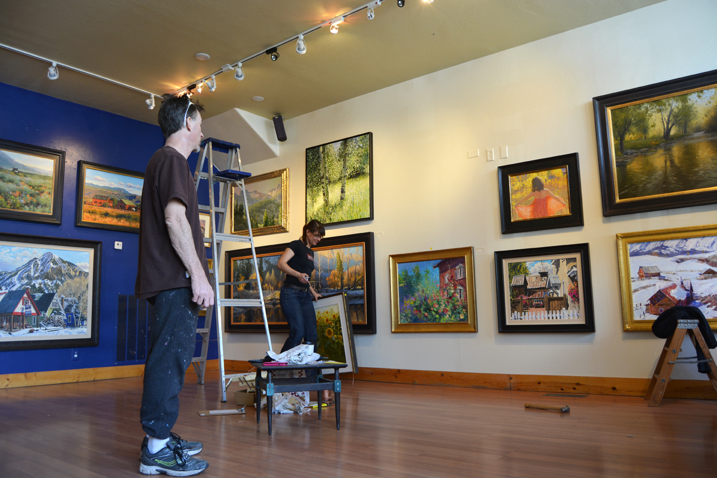 Shaun and Shelley hanging the 2014 Holiday Large Painting Show