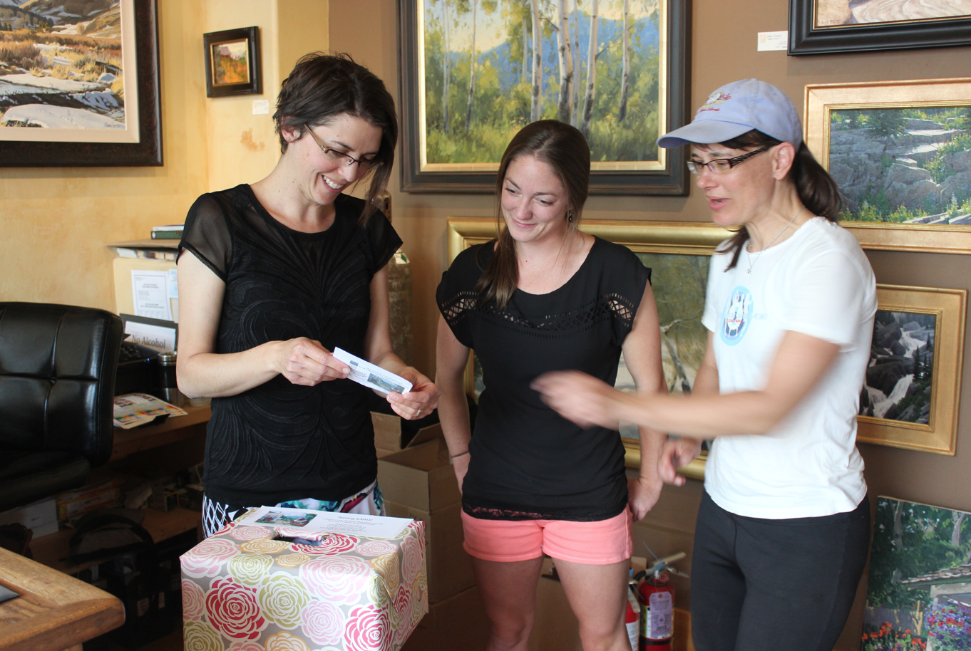 Ivy, Tracy, and Shelley picking the 2014 CBPAI painting raffle winner