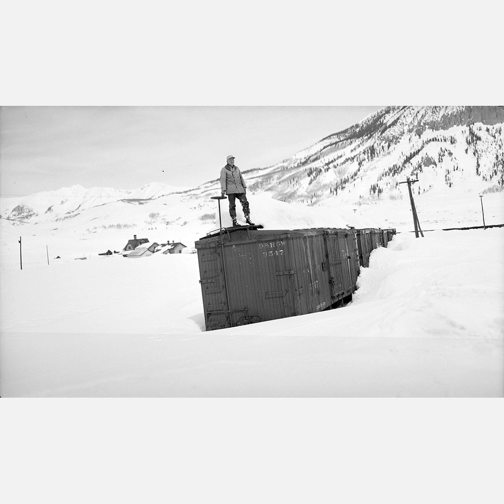 012-a Me STanding, box car deep in the snow on spur, by Bob Richardson DPL Western Collection RR-1118